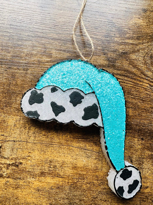 Turquoise and cow Santa hat