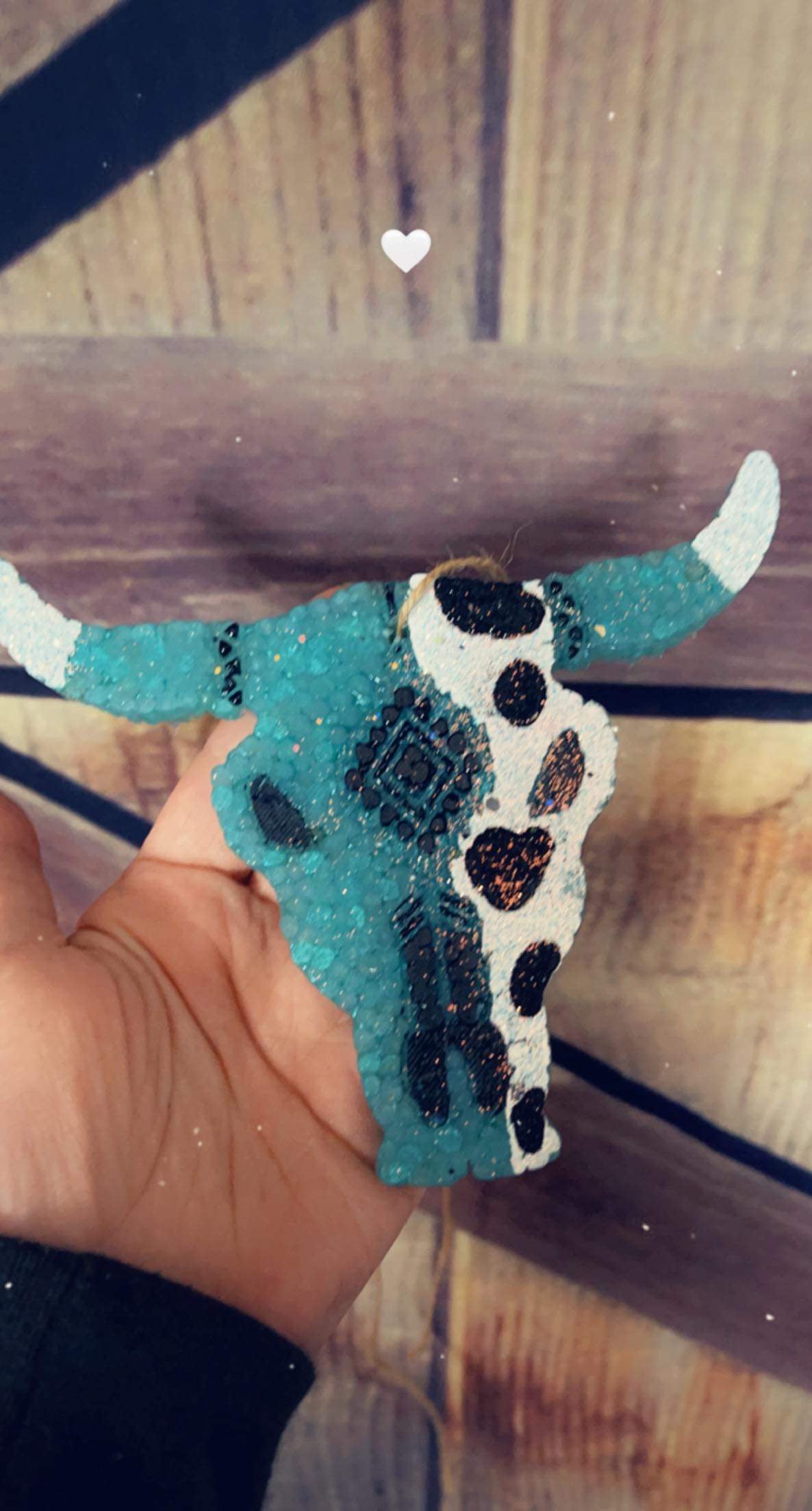 Turquoise and cowprint bull